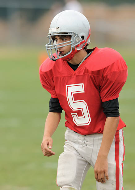 istock High school football player on the field 147313120