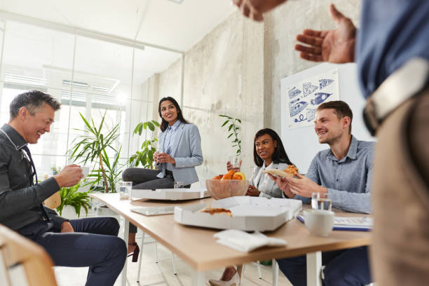 istock Happy business colleagues talking on a break in the office. 1473133189