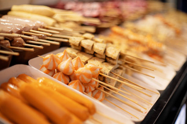 Row of Seafood Skewers Sold by Asian Street Food Vendors stock photo