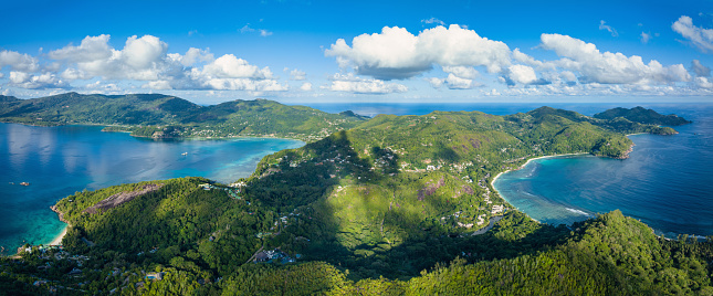 Seychelles Mahe Island Aerial Drone View XXXL Stitched Panorama. Overlooking the beautiful Hill Range at Anse Soleil Beach towards Anse La Liberte Beach, Petite Anse Beach and Anse Aux Poules Bleues and Anse a La Mouche. South-West Coast on Mahé Island. Anse Soleil and Petite Anse at Anse La Liberte, Baie Lazare, Mahe Island, Seychelles Islands, Africa