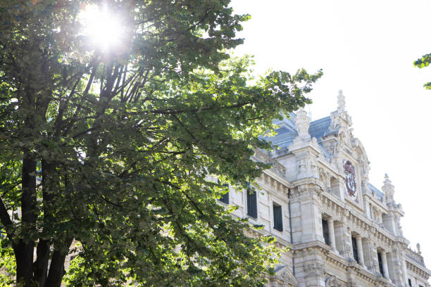istock Magestic building exterior and sunlight through trees in Spain 1473133563