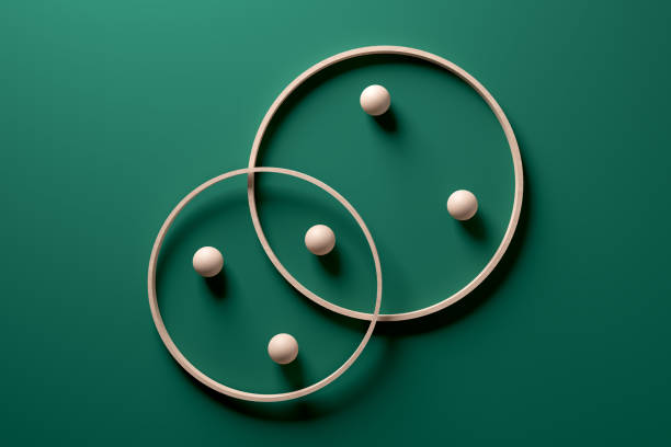 Crossing wooden rings with spheres on green background. Crossing wooden rings with spheres on green background. Modern abstract art with geometric shapes. 3d rendering. things that go together stock pictures, royalty-free photos & images