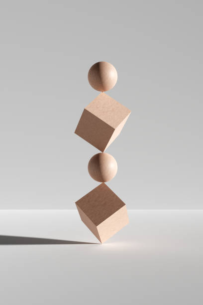istock Wooden cubes and spheres balancing on white background. 1473133774