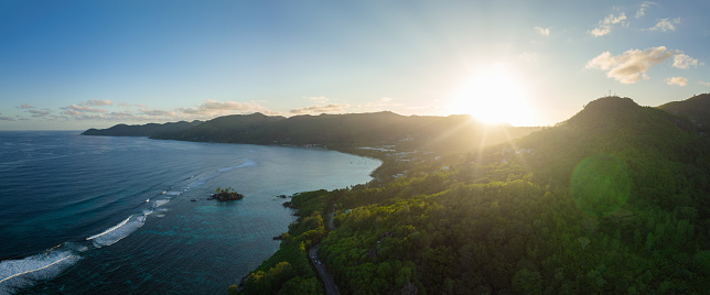 Seychelles Mahe Island Pointe Au Sel - Anse Royale Sunset Panorama. Moody colorful sunset over the Mahe Island coastal hill range of Pointe Au Sel towards Anse Royale Beach and Lagoon with Ile Souris Islet. Stiched XXXL Panorama.. Pointe Au Sel,  Ile Souris, Anse Royale, Eastern Mahé Island, Seychelles Islands, East Africa, Africa