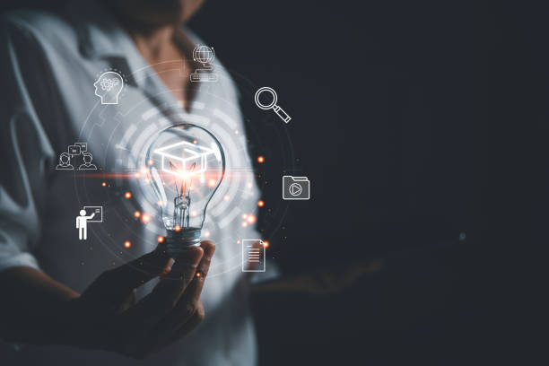 istock Female holding lightbulb showing graduation hat, Internet education course degree, study knowledge to creative thinking idea and solving solution. E-learning graduate certificate program concept. 1473134773