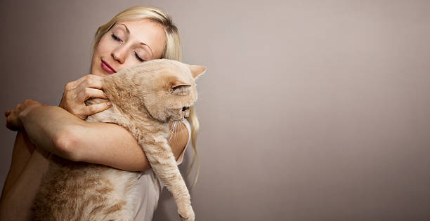 istock Young Woman with Cat 147313688