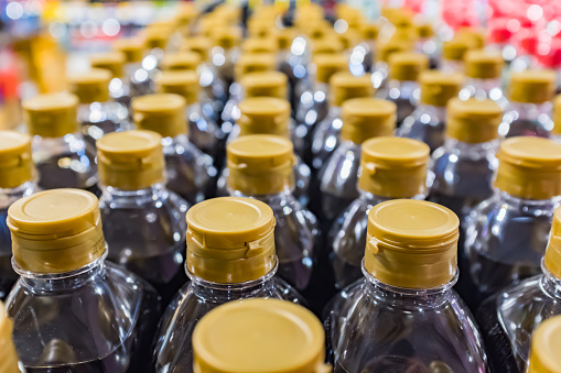 Lots of bottles of soy sauce for sale
