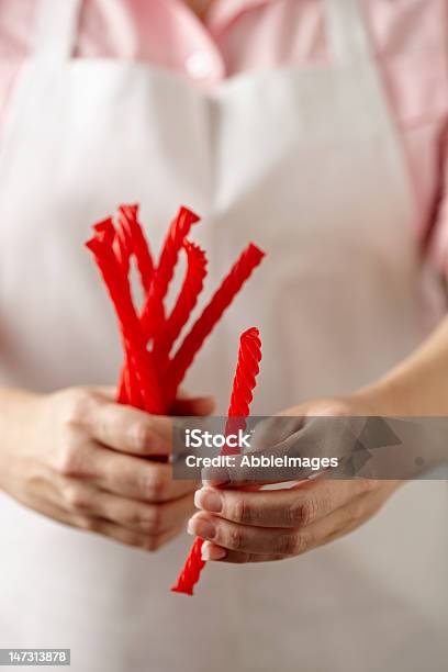 Woman Holding Licorice Stock Photo - Download Image Now - Human Hand,  Licorice, Adult - iStock