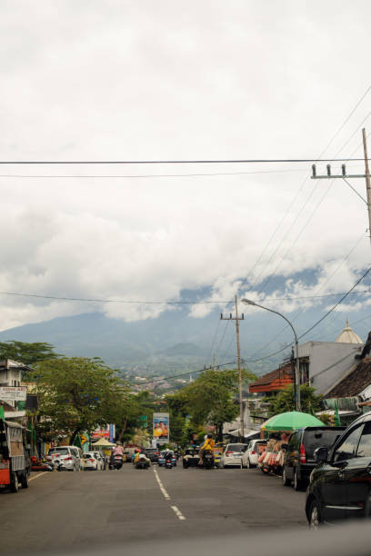 istock Indonesian Street With Cloudy Mountain View Background 1473139542