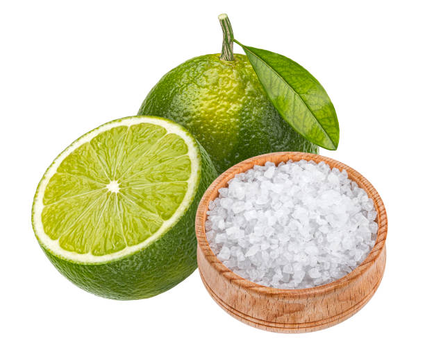 istock Lime slice with salt, margarita cocktail ingredient isolated on white background 1473139945
