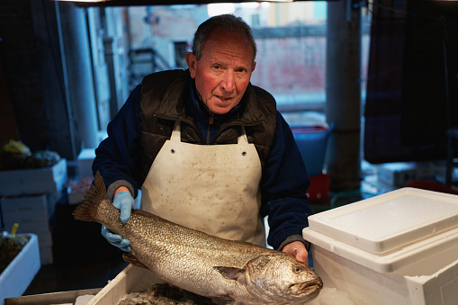 Portrait of the oldest fishmonger from the Pescheria fish market in Venice, Italy.