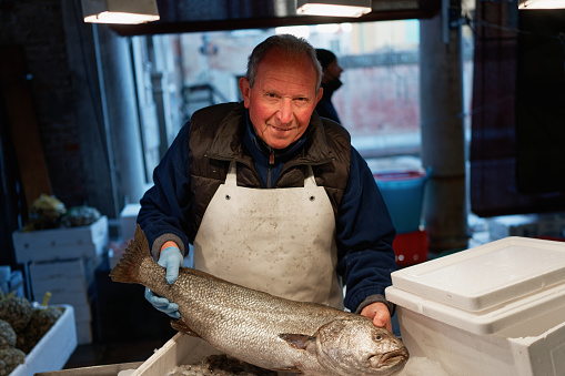 Portrait of the oldest fishmonger from the Pescheria fish market in Venice, Italy.