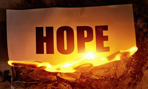 Photo of Hope is destroyed: the word goes up in flames, representing despair