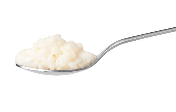 Pure rice pudding on spoon stock photo