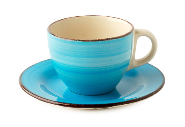 istock Ceramic cup and saucer isolated on white 1473142530