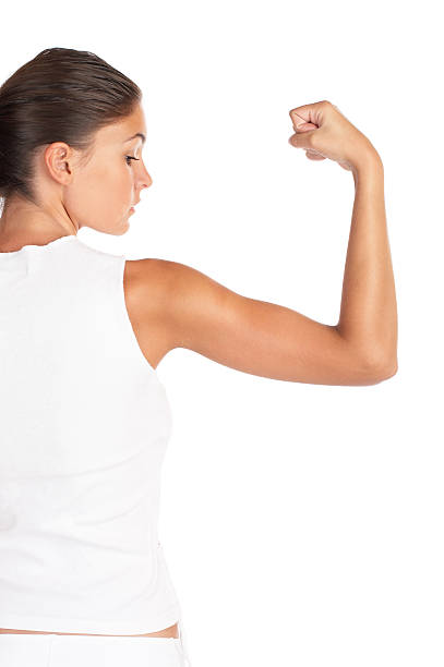istock A woman wearing white flexing her arm 147314429