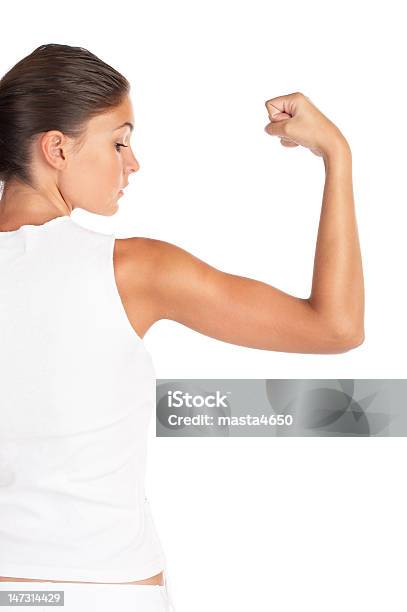 A Woman Wearing White Flexing Her Arm Stock Photo - Download Image Now - Women, One Woman Only, White Background