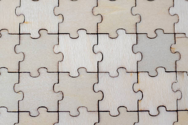 istock Puzzle pieces grid, jigsaw puzzle beige wood, success mosaic solution template, horizontal. Blank assembled puzzles with copy space. 1473144406