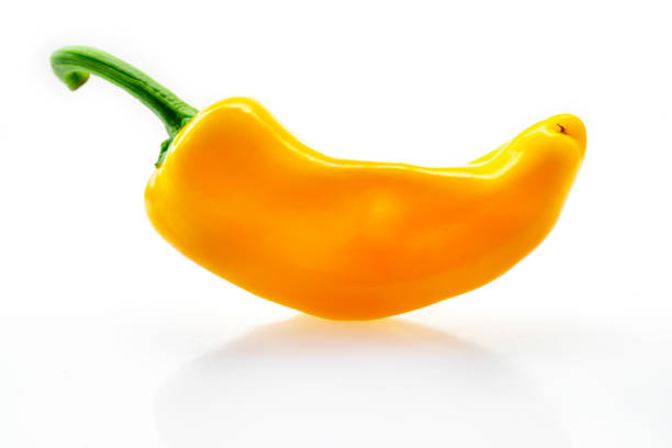 Yellow fresh bell peppers on a white background