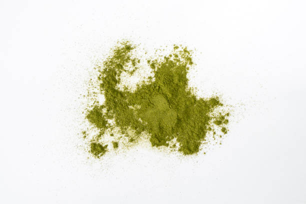 istock Wheatgrass powder scattered on a white background. Alternative medicine, herbal nutritional supplement 1473144753