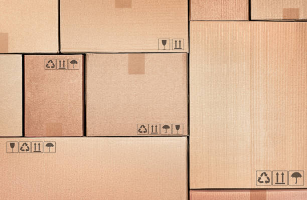 background boxes background of many empty cardboard boxes storage-compartment stock pictures, royalty-free photos & images