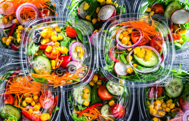 istock Boxes with pre-packaged vegetable salads in a commercial fridge 1473146956