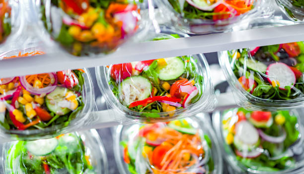 istock Boxes with pre-packaged vegetable salads in a commercial fridge 1473146967