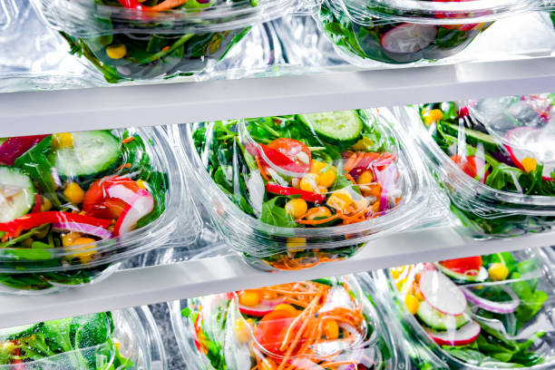istock Boxes with pre-packaged vegetable salads in a commercial fridge 1473146998