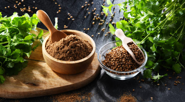 istock Ground coriander, its dried seeds and fresh leaves 1473147869