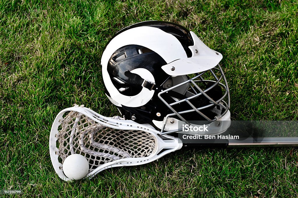 Lacrosse Equipment Lacrosse stick, ball and helmet on grass Lacrosse Stock Photo