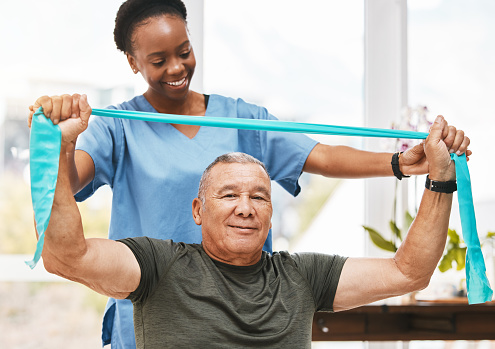 Physiotherapy support, stretching band and nurse with senior man for physical therapy, rehabilitation and healthcare help. Black woman chiropractor or physiotherapy doctor consulting elderly patient