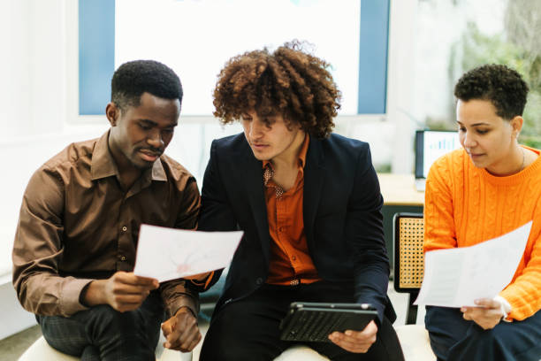 istock Young colleagues of a startup analyze data together and study strategies 1473150286