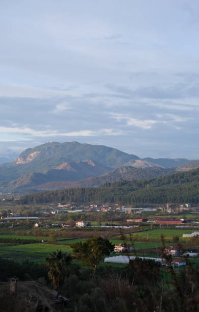 istock landscape of valley with mountain forest fields houses 1473150291