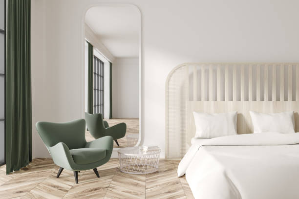 istock Front view on bright bedroom interior with bed, armchair, mirror 1473150779