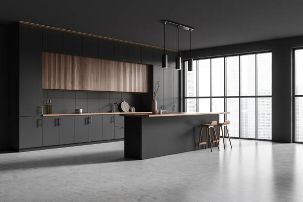 istock Corner view on dark kitchen room interior with island, barstools 1473151765