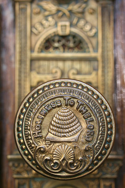 Salt Lake Temple Doorknob Macro of Bronze doorknob of Salt Lake Temple with shallow depth of field. mormonism stock pictures, royalty-free photos & images