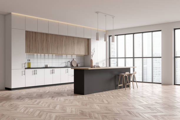 istock Corner view on bright kitchen room interior with island 1473152754