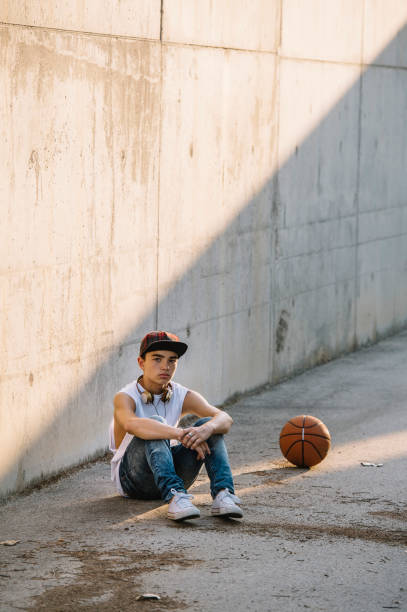 istock Young Man Holding a Basketball Ball 1473153650