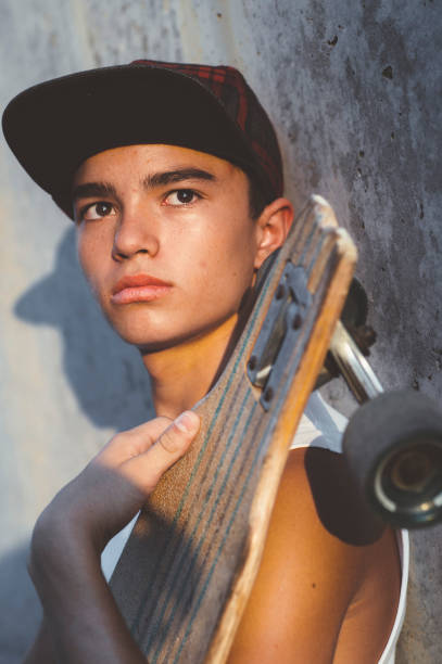 istock Boy skater posing with skateboard. 1473153962