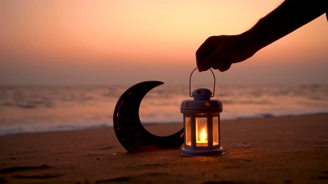 Lantern lamp with Crescent moon shape on the beach