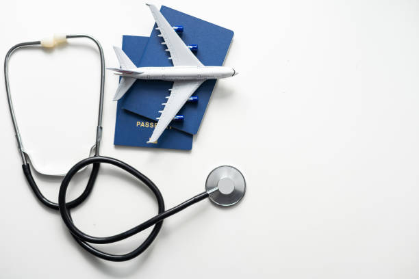 istock Passport, stethoscope and toy plane 1473155299