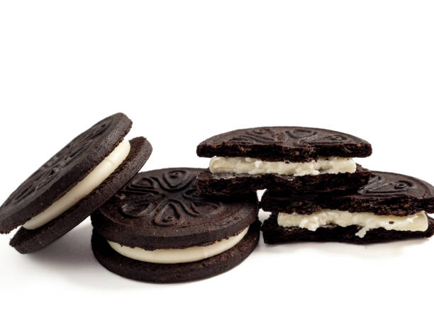 istock Black tasty cookies isolated on white background. 1473155424