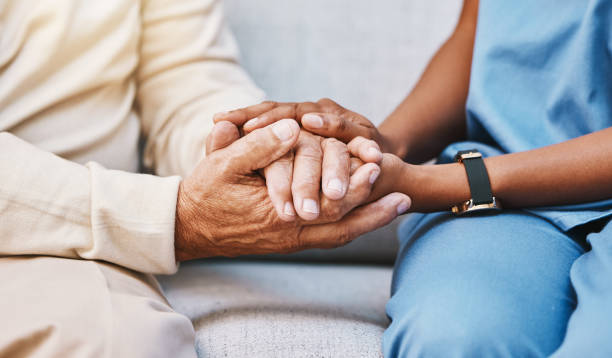 nurse, hands and senior patient in empathy, safety and support of help, trust and healthcare consulting. nursing home, counseling and gratitude for medical caregiver, client and hope in consultation - ouderenzorg stockfoto's en -beelden