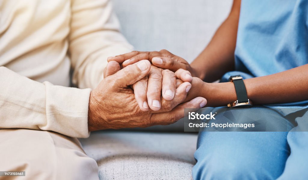 Nurse, hands and senior patient in empathy, safety and support of help, trust and healthcare consulting. Nursing home, counseling and gratitude for medical caregiver, client and hope in consultation Nursing Home Stock Photo