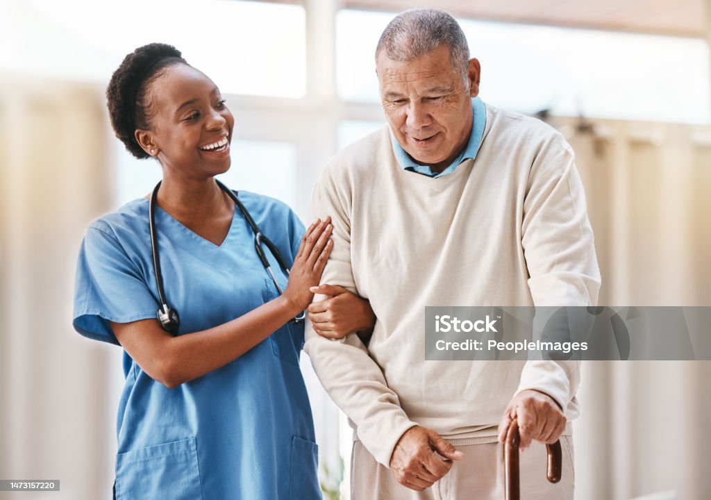 Help, support and medical with nurse and old man and cane for retirement, rehabilitation or healing. Empathy, physical therapy and healthcare with patient and walking stick in caregiver nursing home Nurse Stock Photo