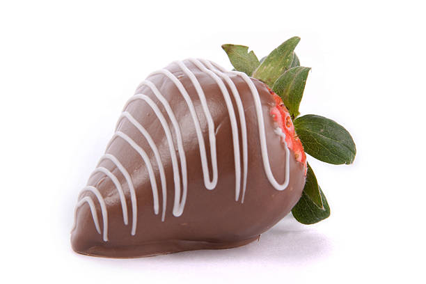 Strawberry covered with chocolate A chocolate covered strawberry with drizzled white chocolate chocolate covered strawberries stock pictures, royalty-free photos & images