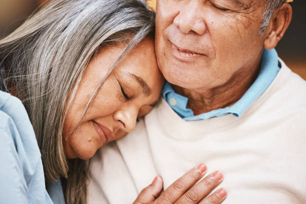 istock Love, grief and elderly couple hugging with support, bonding and spending quality time together at home. Affection, loss and sad senior man and woman in retirement embracing with care at their house. 1473158430