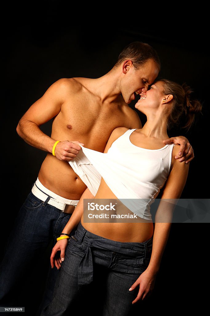 Couple over black Young sexy couple over black bacground. Adult Stock Photo