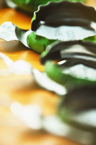 Capsules with pull-tabs from juice, extreme close-up, divination
