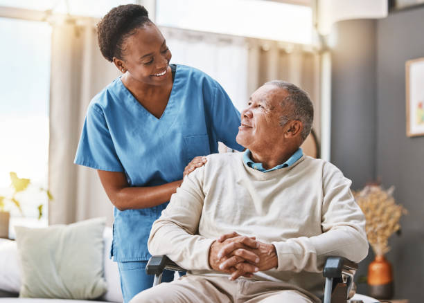 help, support and wheelchair with nurse and old man for disability, rehabilitation or healing. retirement, physiotherapy and healthcare with patient and black woman nursing home for medical caregiver - ouderenzorg stockfoto's en -beelden
